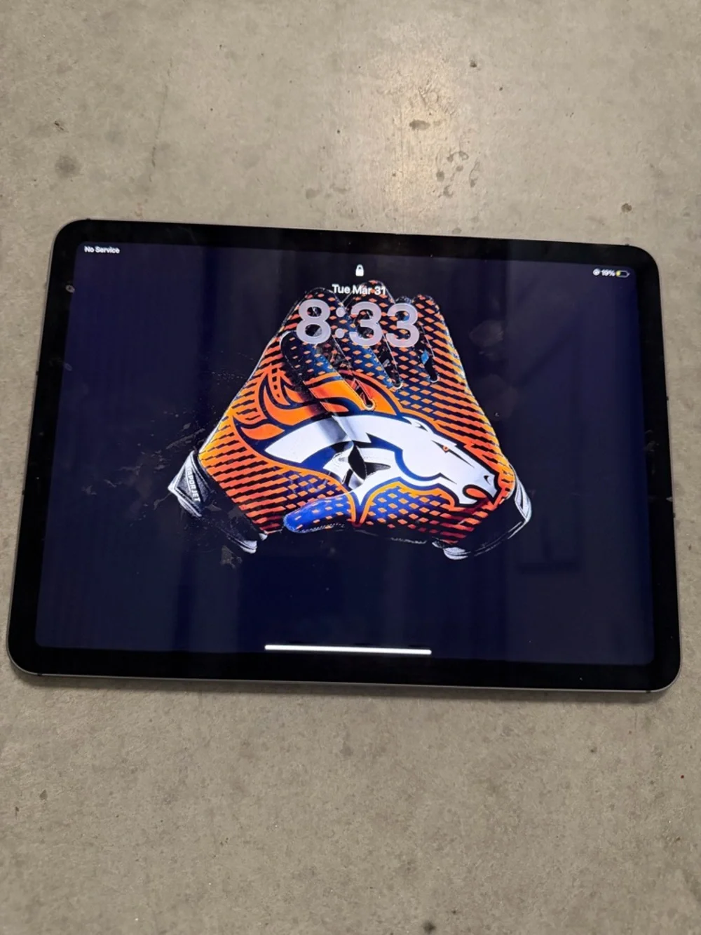 Apple Tablet in Black with Orange & Blue Team Wallpaper